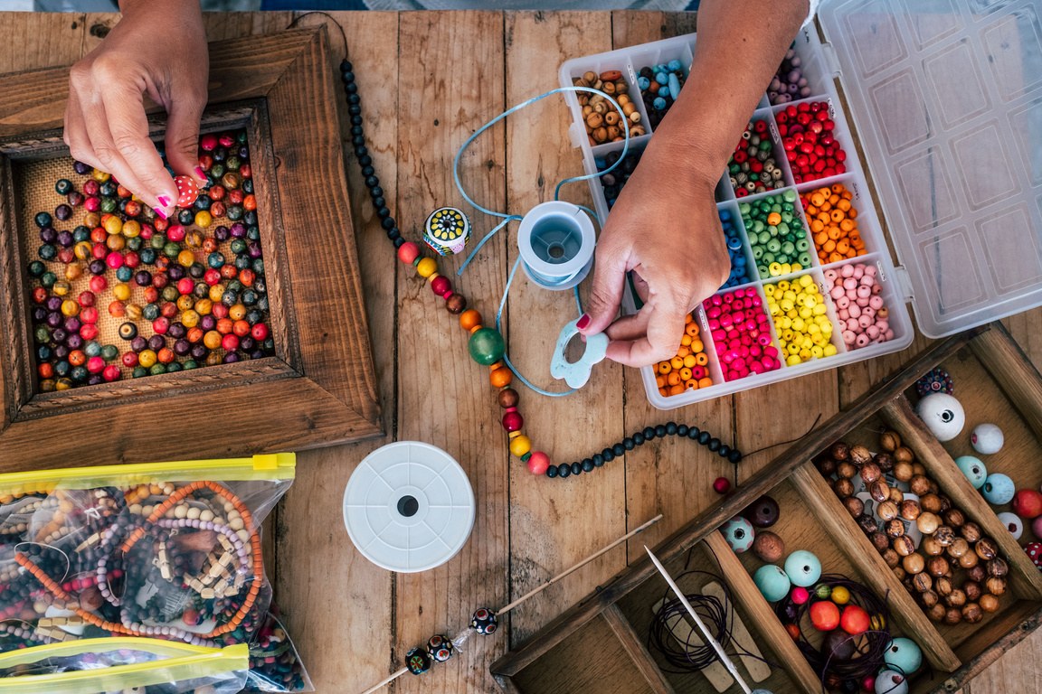 Colourful beads being used for a craft activity